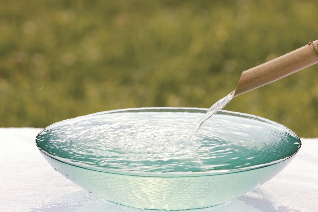 Water flowing into a bowl